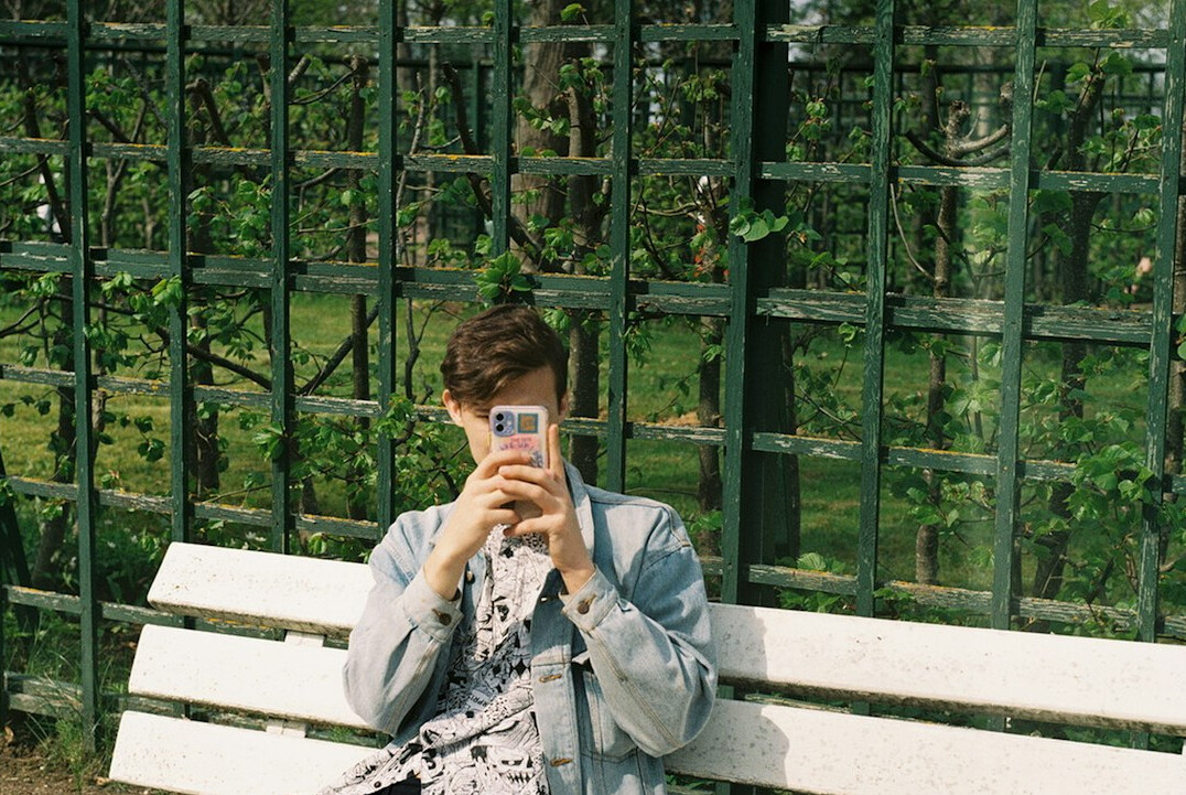person sitting park bench
